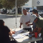 A few of the customers registering to win raffle prizes.
